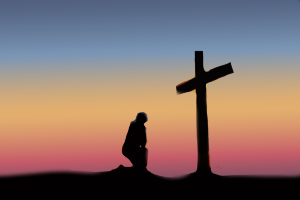 homme agenouillé devant une croix